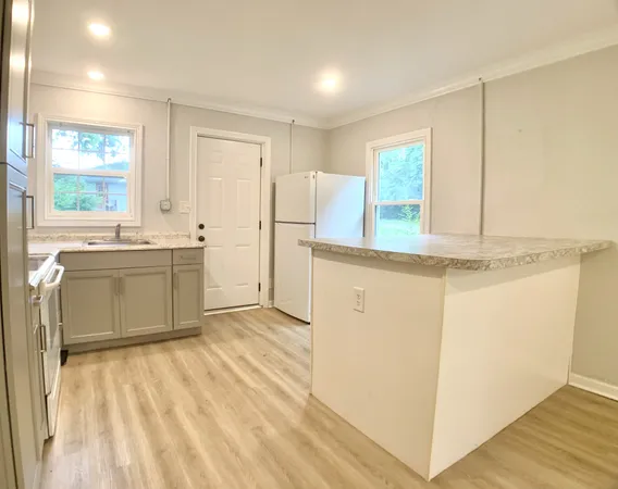 a view of a kitchen with a sink