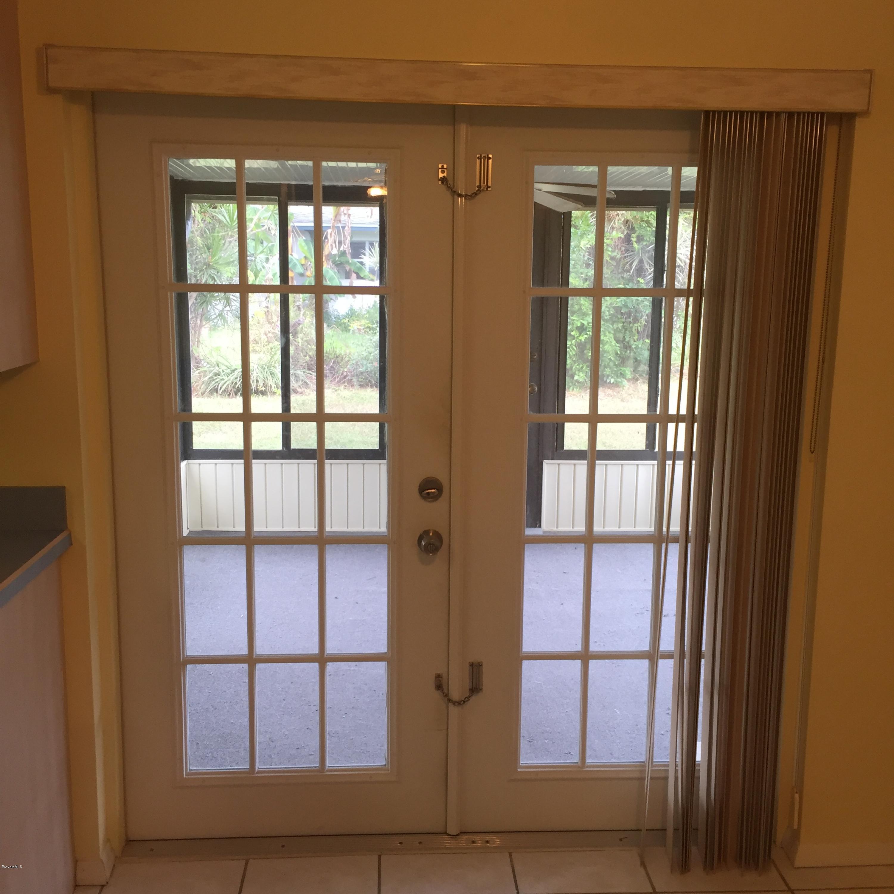 2860 Rheims Avenue Melbourne, FL 32935 - Photo 14 of 22 Doors To Porch