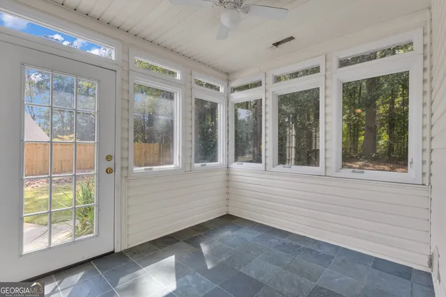 a view of empty room with windows