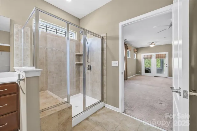 a bathroom with a tub and shower