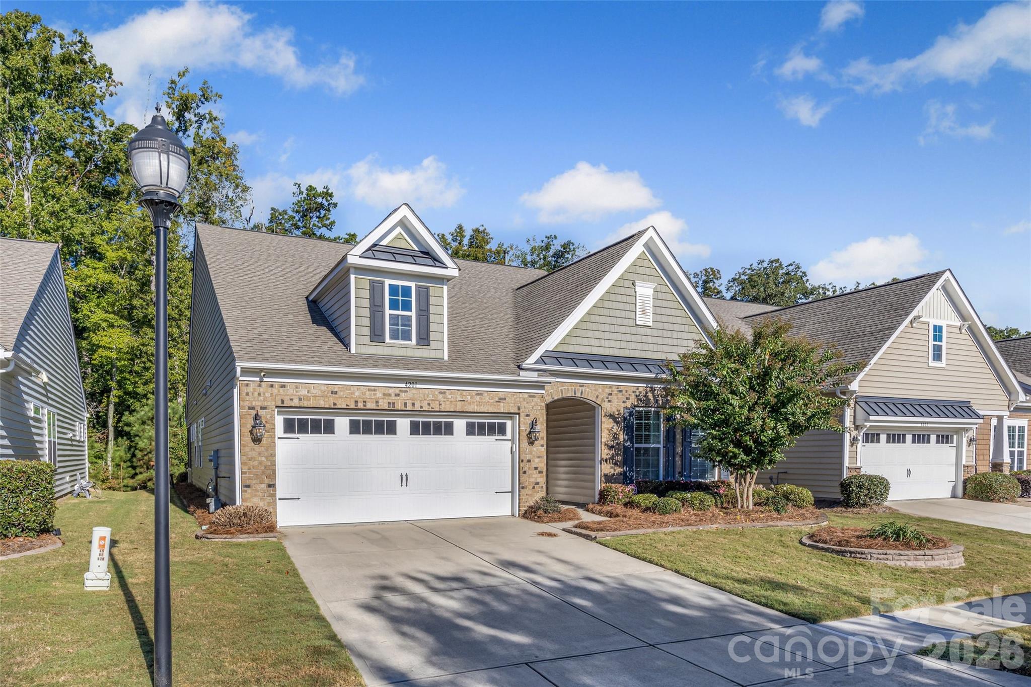 4201 Perth Road Fort Mill, SC 29707 - Photo 2 of 35 a front view of a house with a yard and garage