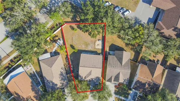 an aerial view of a house with a garden