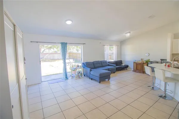 a living room with furniture and a window