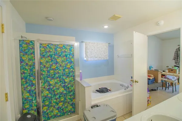 a bathroom with a sink a toilet and shower curtain