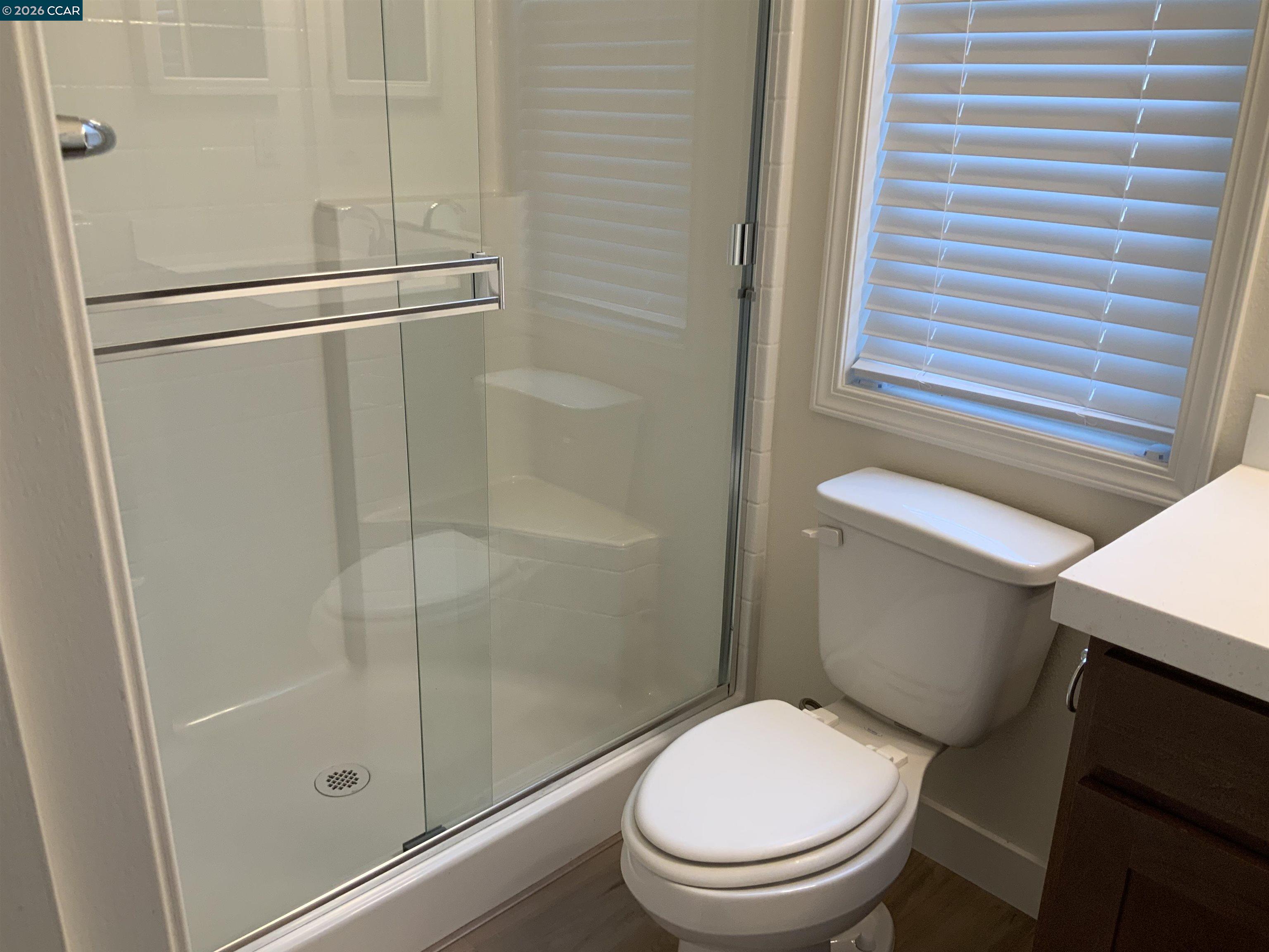 65 Pali Way Pittsburg, CA 94565 - Photo 16 of 32 a white toilet sitting next to a bath tub