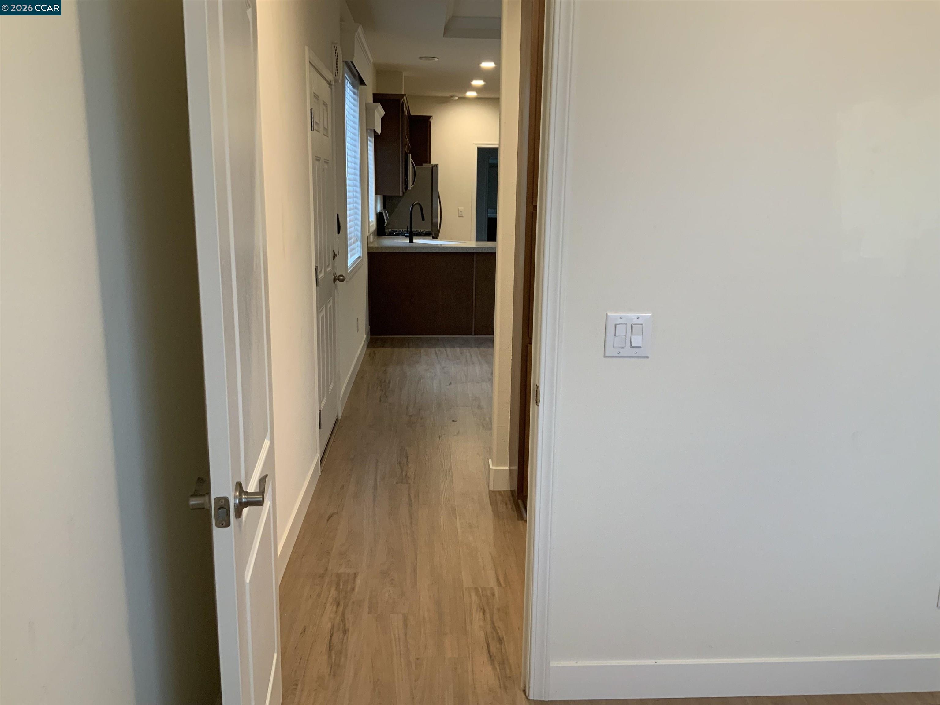 65 Pali Way Pittsburg, CA 94565 - Photo 21 of 32 a view of a hallway with wooden floor and staircase