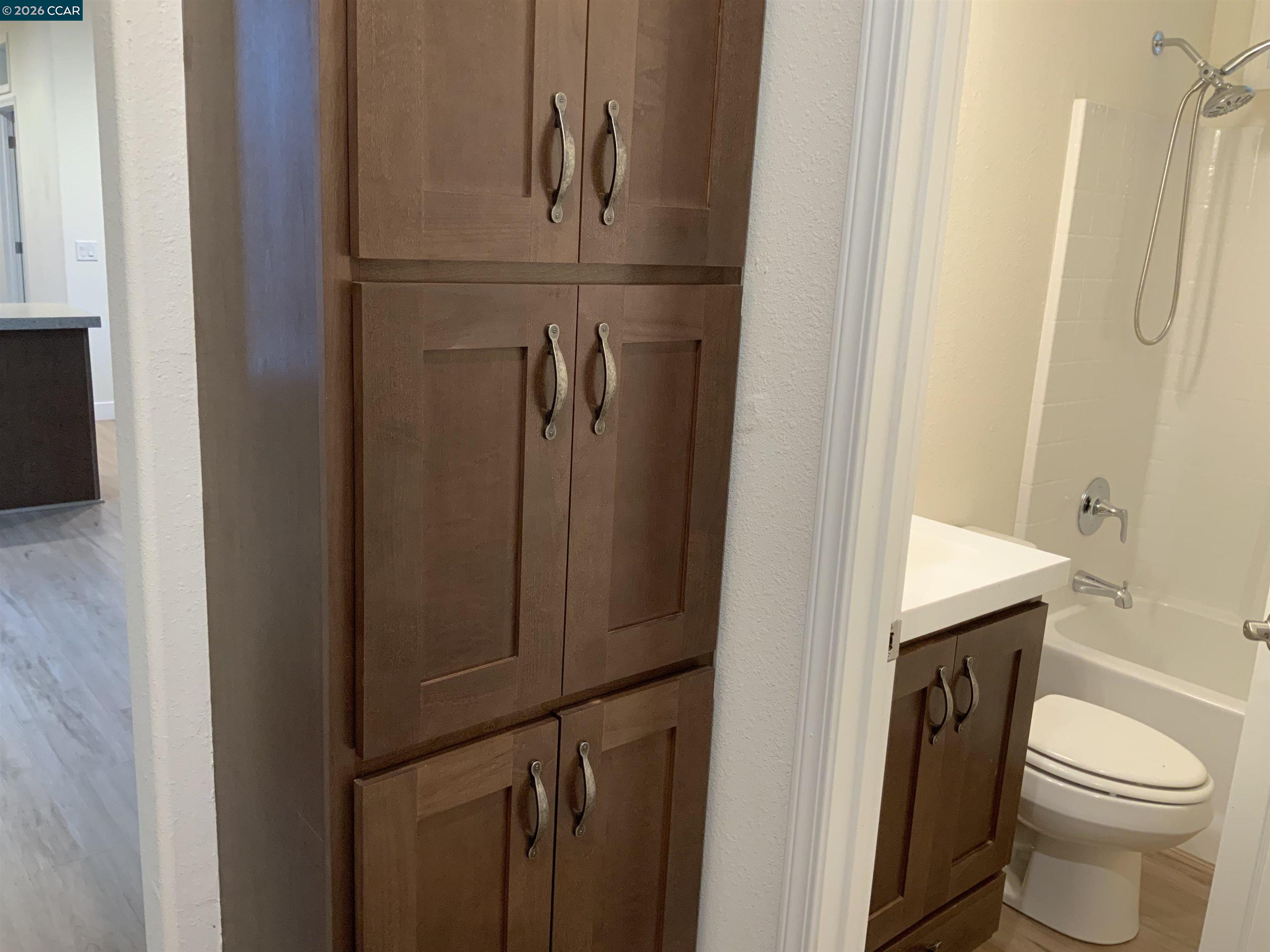 65 Pali Way Pittsburg, CA 94565 - Photo 22 of 32 a bathroom with a toilet and a sink