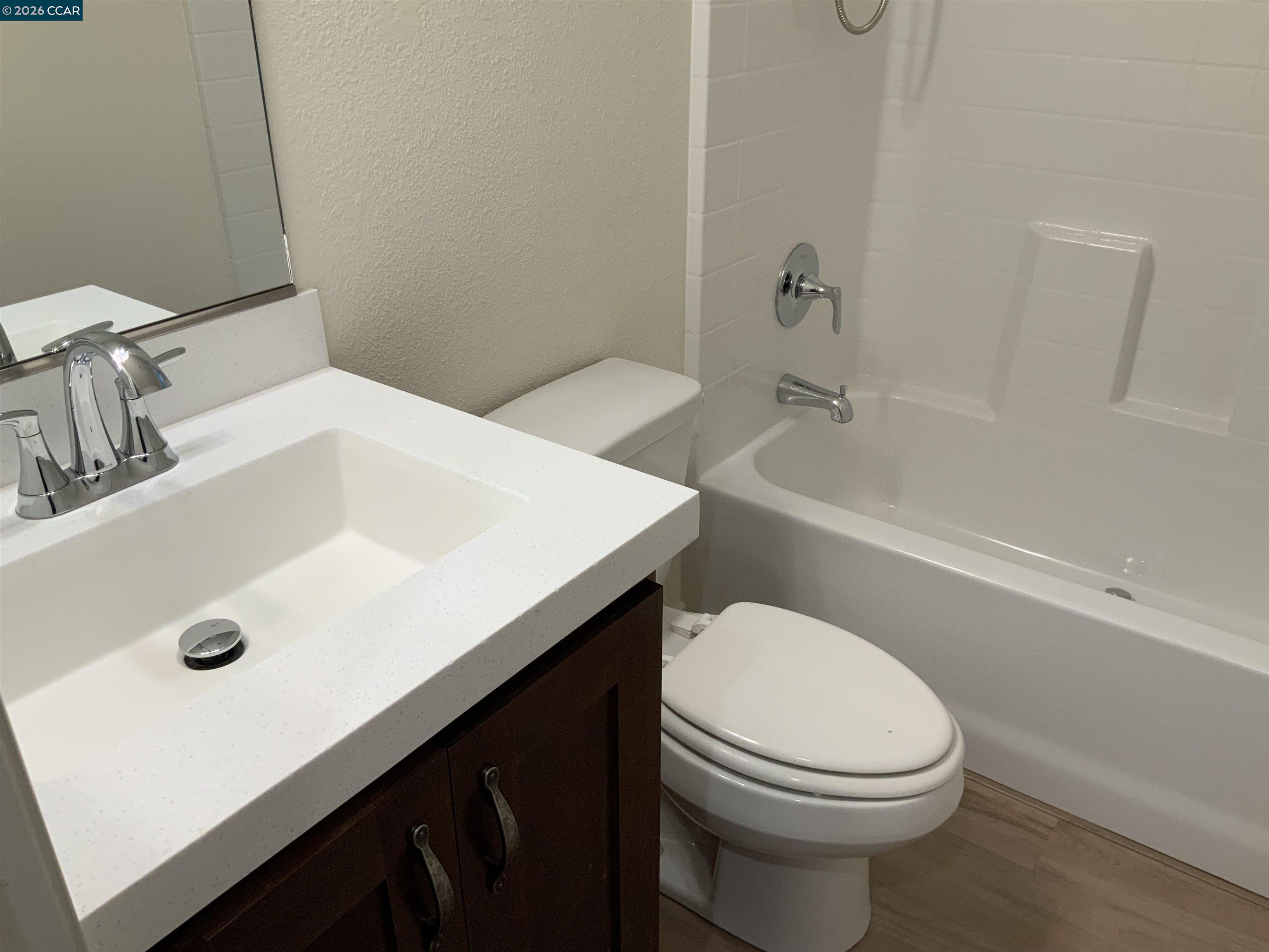 65 Pali Way Pittsburg, CA 94565 - Photo 23 of 32 a bathroom with a sink a toilet and bathtub