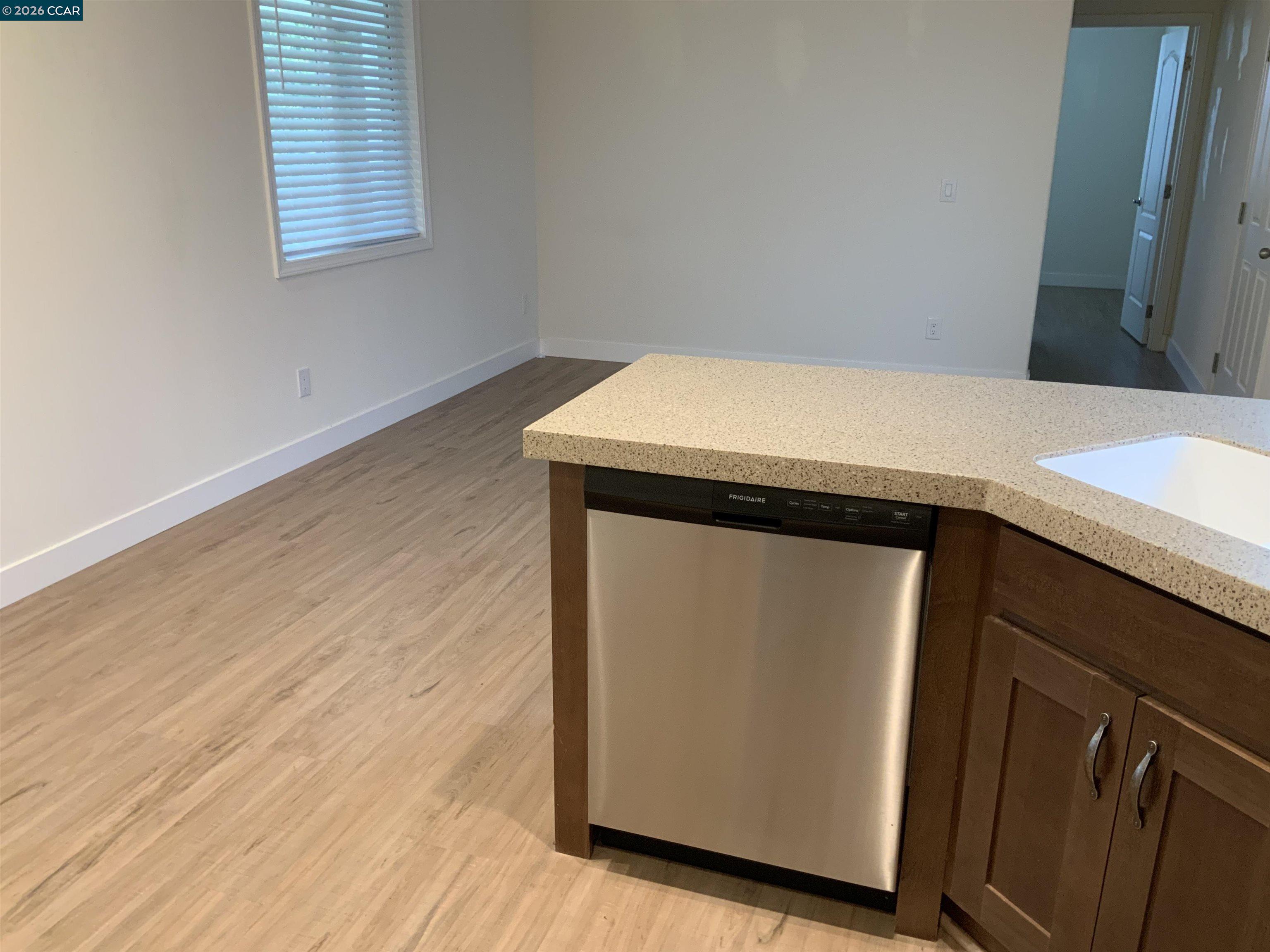 65 Pali Way Pittsburg, CA 94565 - Photo 9 of 32 a utility room with wooden floor washer and dryer