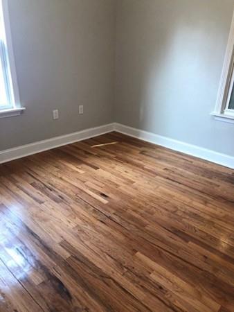 83 Dana Street Springfield, MA 01104 - Photo 13 of 20 a view of empty room with wooden floor and fan