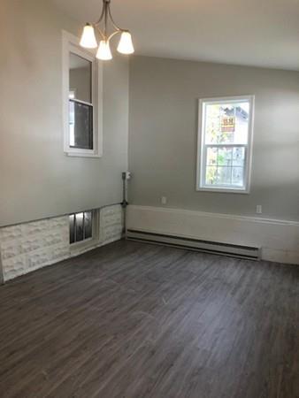 83 Dana Street Springfield, MA 01104 - Photo 16 of 20 wooden floor in an empty room with a window
