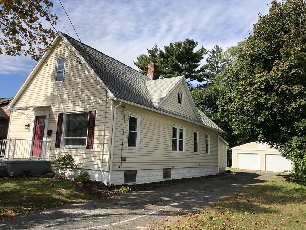 83 Dana Street Springfield, MA 01104 - Photo 3 of 20 a view of a house with a yard