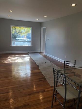 83 Dana Street Springfield, MA 01104 - Photo 6 of 20 a view of room and wooden floor