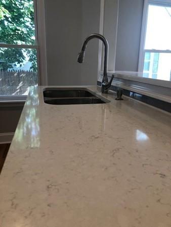 83 Dana Street Springfield, MA 01104 - Photo 9 of 20 a close view of a faucet in the kitchen