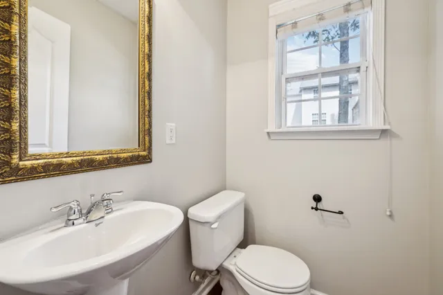 a bathroom with a sink and a window