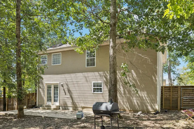 a view of a house with a tree