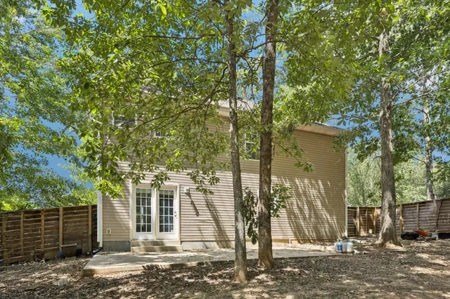 a view of a yard with a tree