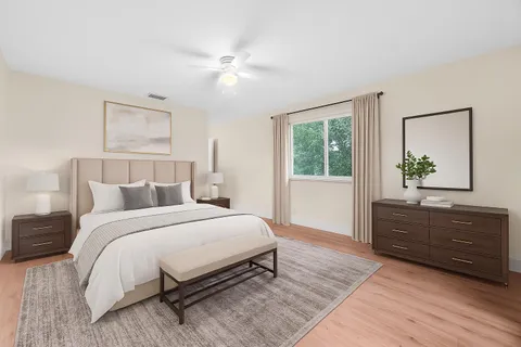 a bedroom with a bed and a dresser