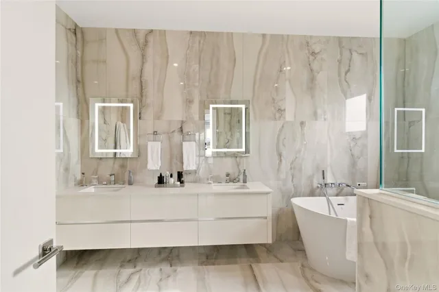 a bathroom with a tub and shower