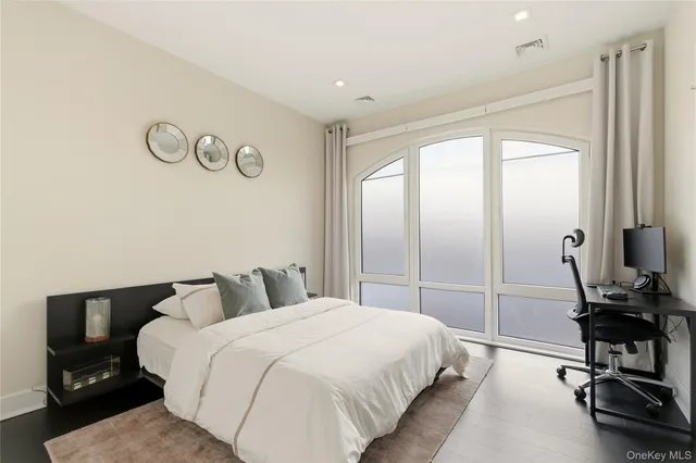 a en suite bathroom with a tub sink and mirror