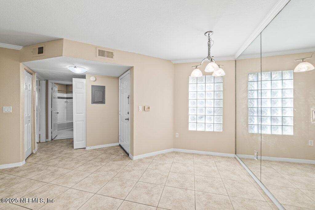 10150 Belle Rive Boulevard, Unit 303 Jacksonville, FL 32256 - Photo 3 of 23 a view of an empty room with a window