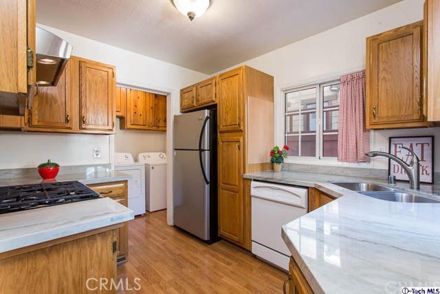 1707 Arlington Avenue Glendale, CA 91208 - Photo 13 of 39 a kitchen with granite countertop a refrigerator stove and sink