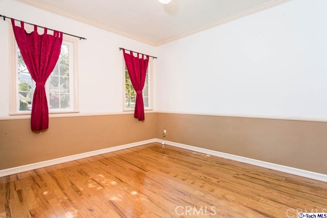 1707 Arlington Avenue Glendale, CA 91208 - Photo 22 of 39 a view of a room with wooden floor and a large window