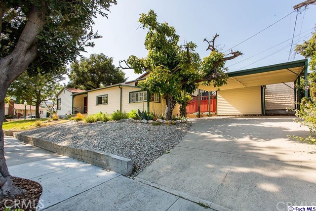 1707 Arlington Avenue Glendale, CA 91208 - Photo 3 of 39 a front view of a house with a yard and garage