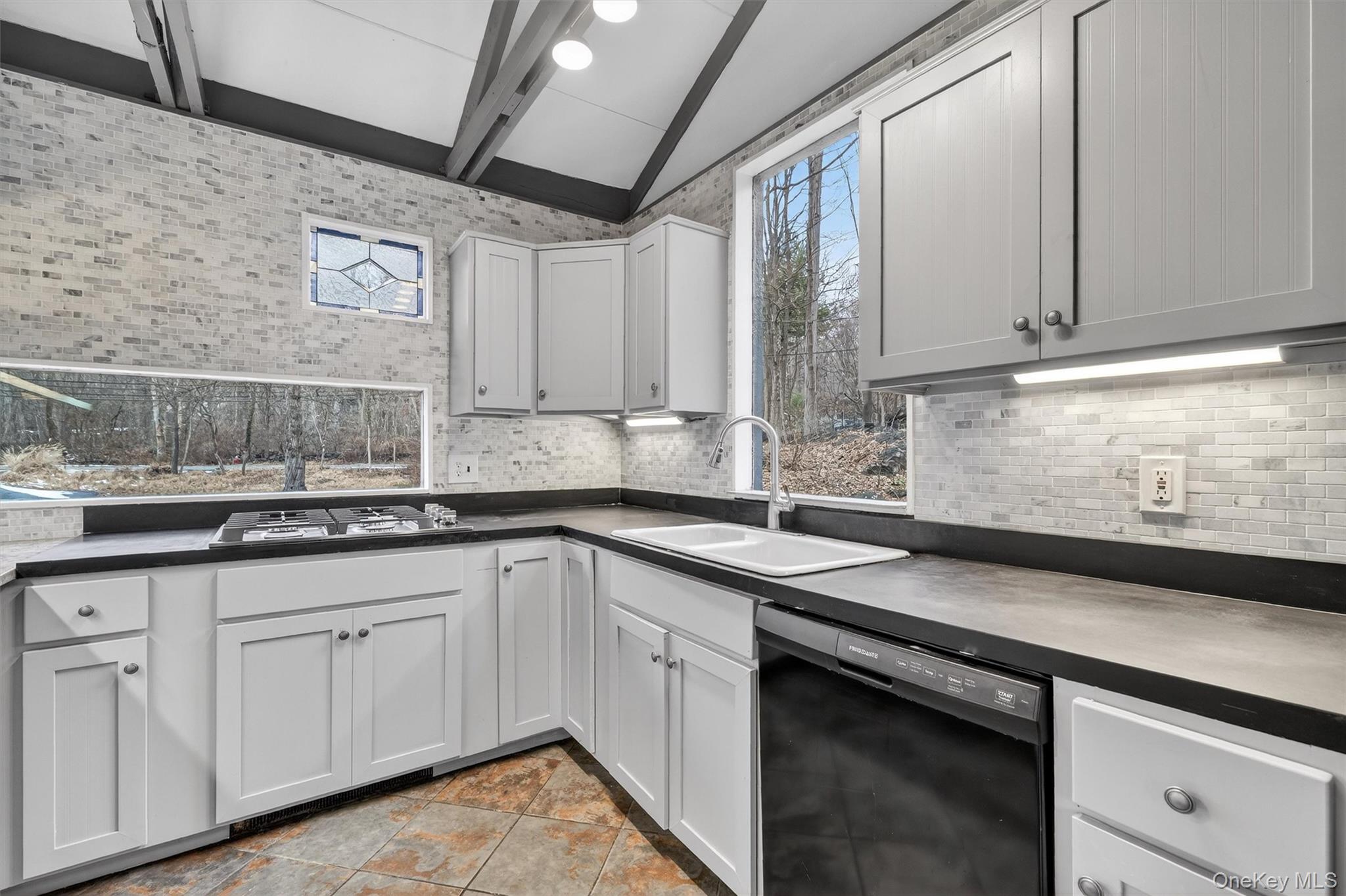 98 South Mount Airy Road Croton-on-Hudson, NY 10520 - Photo 11 of 36 a kitchen with sink cabinets and window