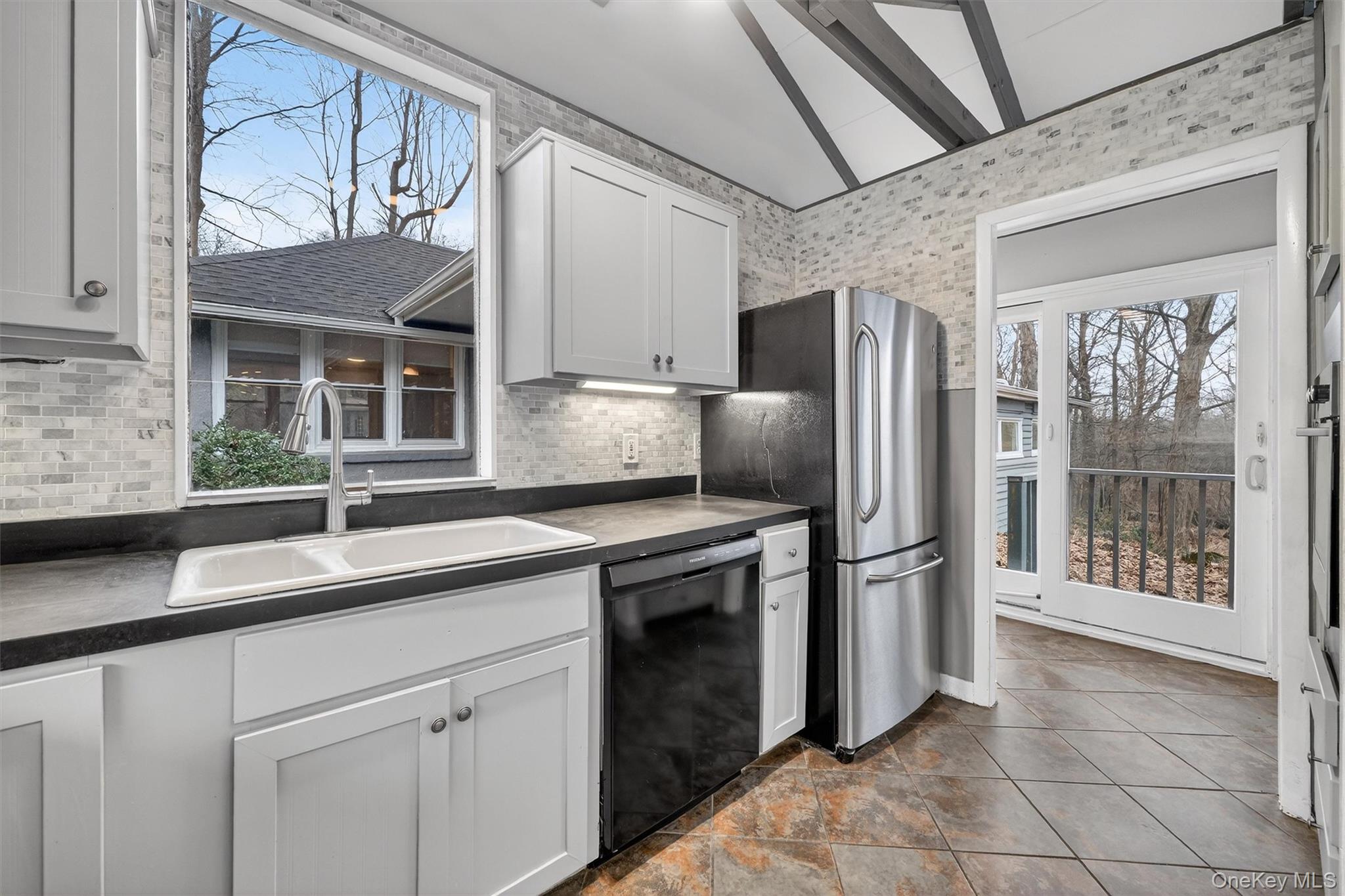 98 South Mount Airy Road Croton-on-Hudson, NY 10520 - Photo 15 of 36 a kitchen with stainless steel appliances granite countertop a refrigerator and a sink