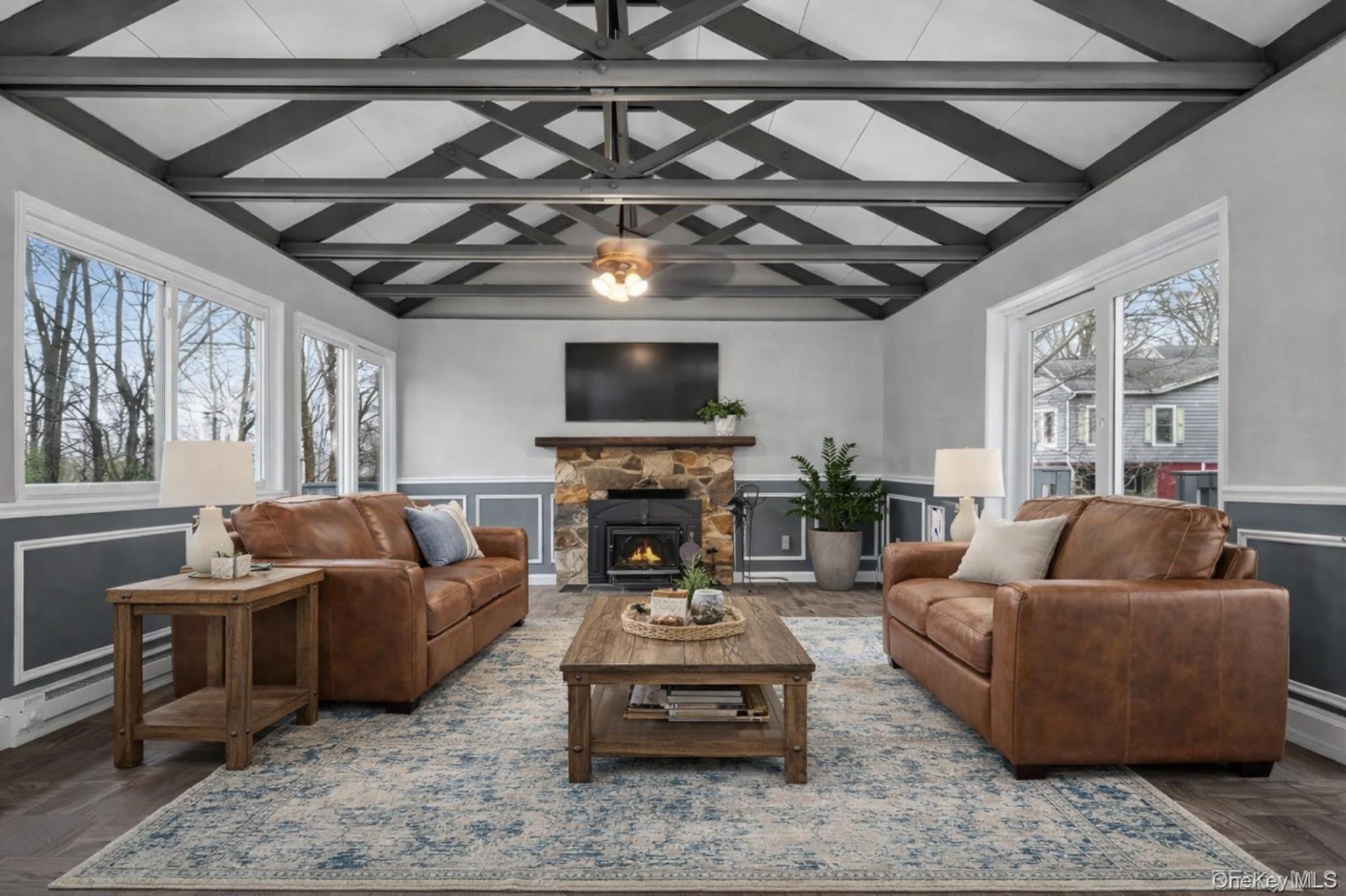 98 South Mount Airy Road Croton-on-Hudson, NY 10520 - Photo 2 of 36 a living room with furniture a fireplace and a flat screen tv
