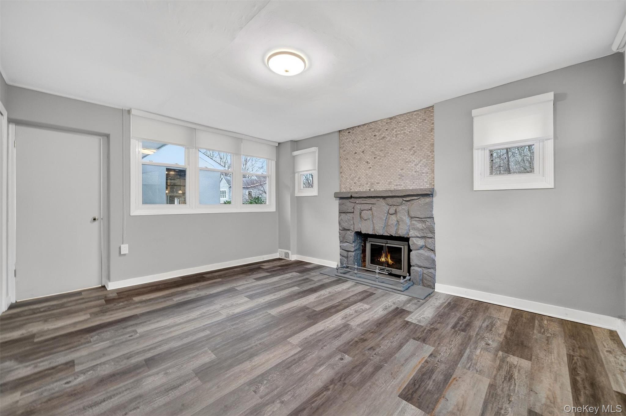 98 South Mount Airy Road Croton-on-Hudson, NY 10520 - Photo 21 of 36 a view of a livingroom with a fireplace wooden floor and window