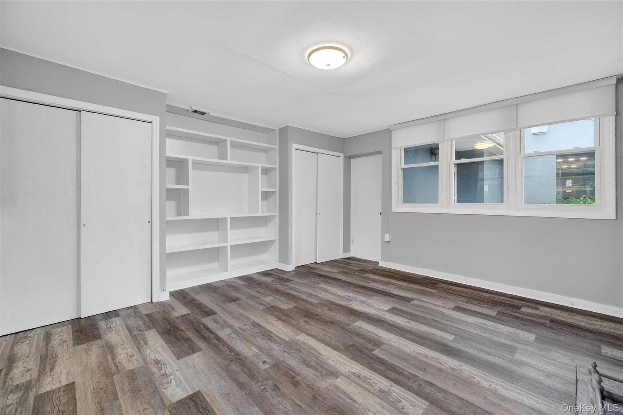 98 South Mount Airy Road Croton-on-Hudson, NY 10520 - Photo 22 of 36 a view of empty room with wooden floor and fan