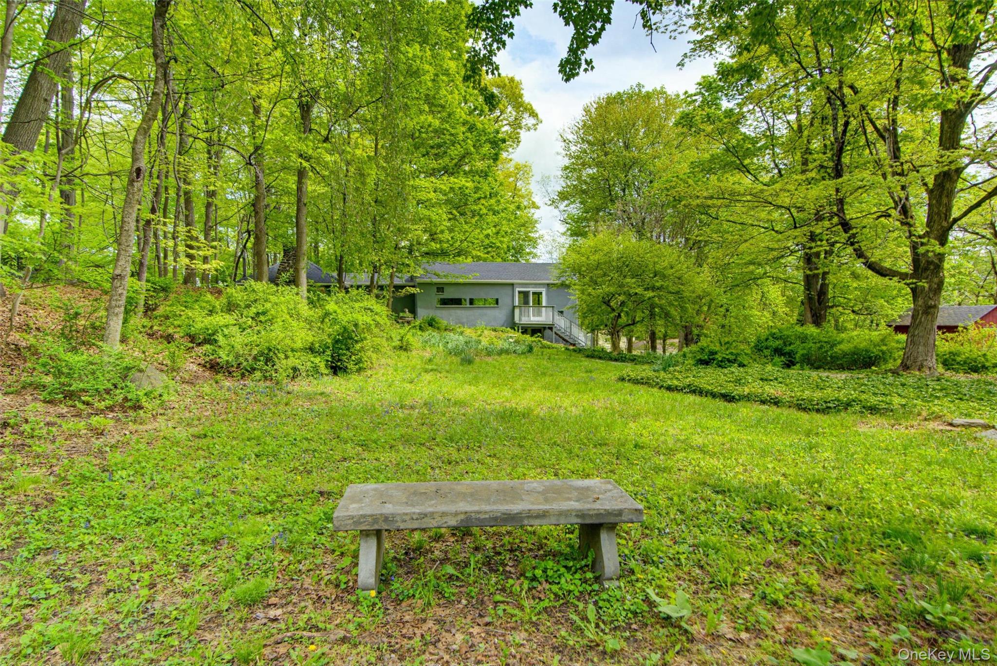 98 South Mount Airy Road Croton-on-Hudson, NY 10520 - Photo 34 of 36 a view of a wooden bench sitting in the garden