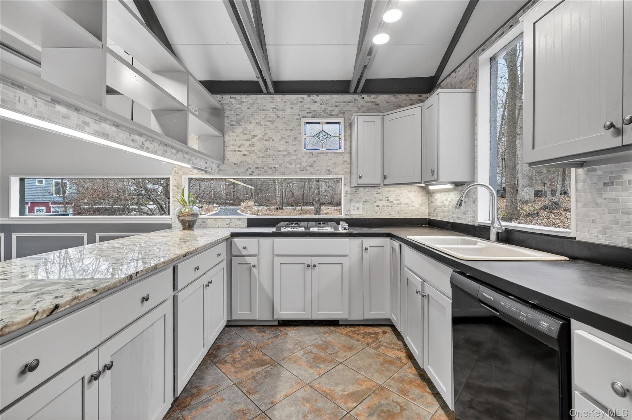 98 South Mount Airy Road Croton-on-Hudson, NY 10520 - Photo 10 of 36 a kitchen with granite countertop lots of white cabinets and a sink