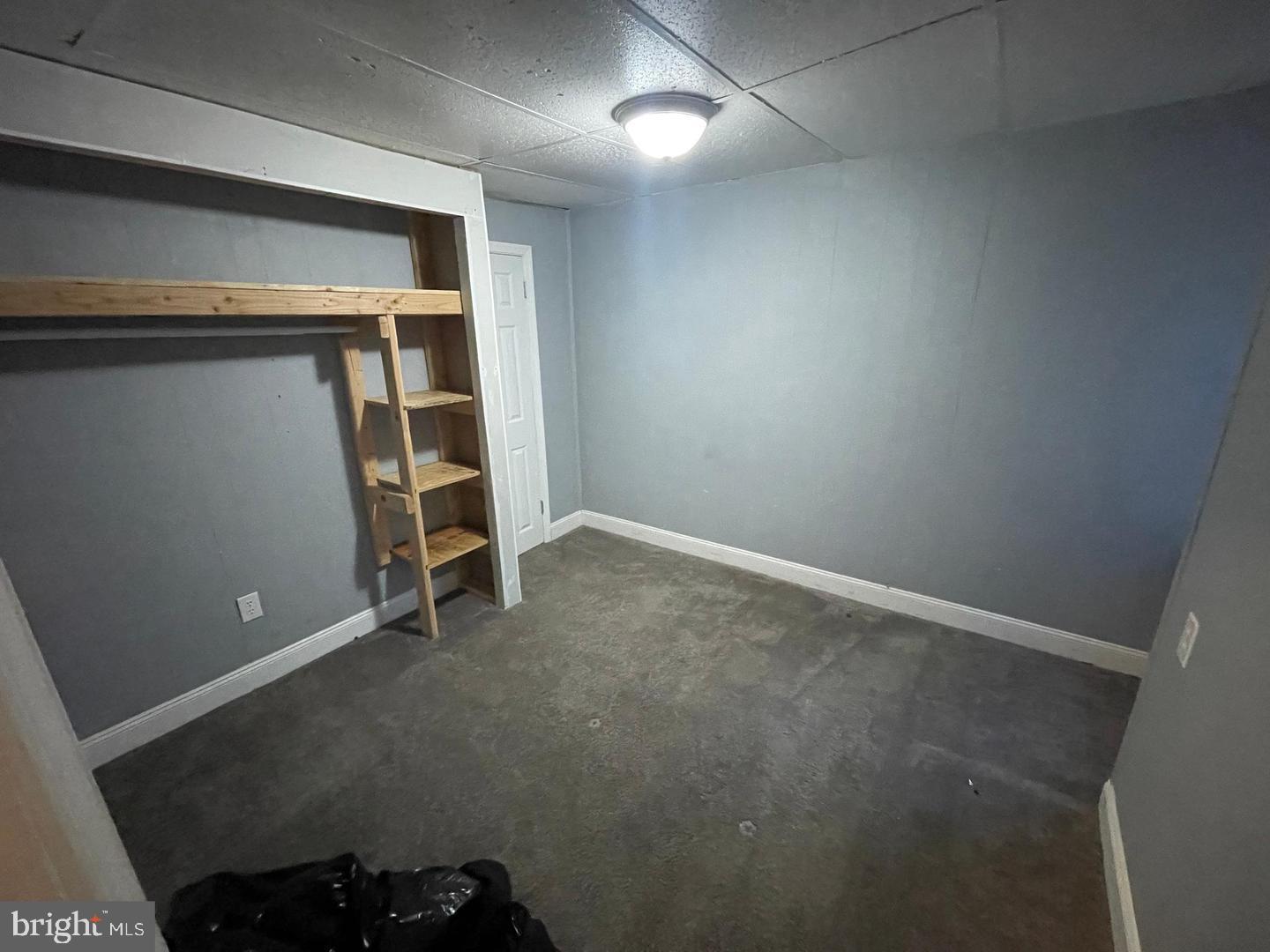 1124 Thomas Street Chester, PA 19013 - Photo 9 of 11 an empty room with a bench