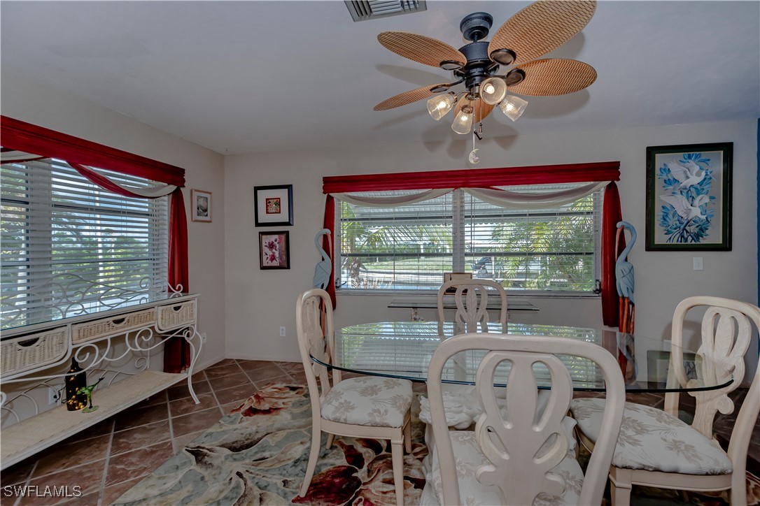 12101 Moon Shell Drive Matlacha Isles, FL 33991 - Photo 15 of 42 a dining room with furniture and window
