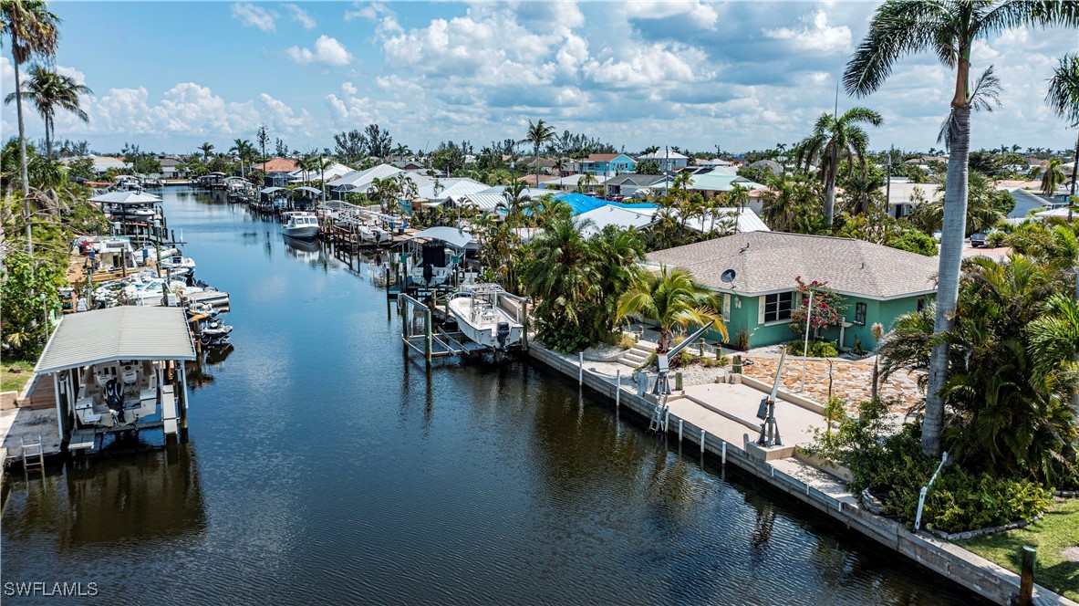 12101 Moon Shell Drive Matlacha Isles, FL 33991 - Photo 32 of 42 an aerial view of a house with a lake view
