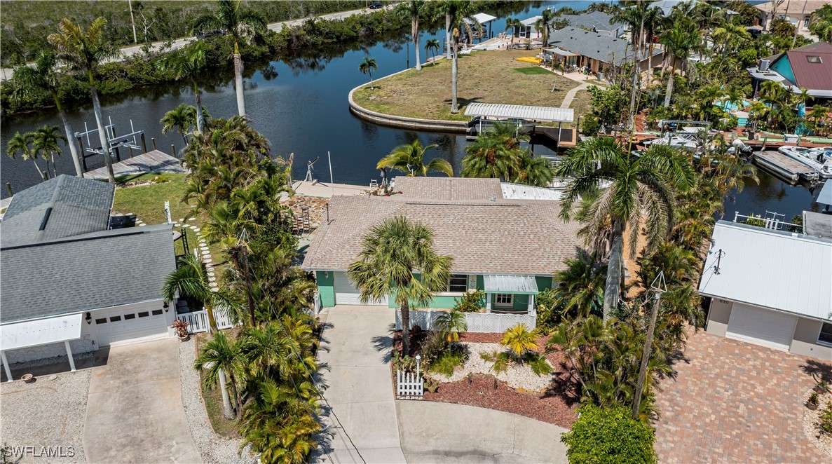 12101 Moon Shell Drive Matlacha Isles, FL 33991 - Photo 34 of 42 an aerial view of a house with table and chairs and potted plants