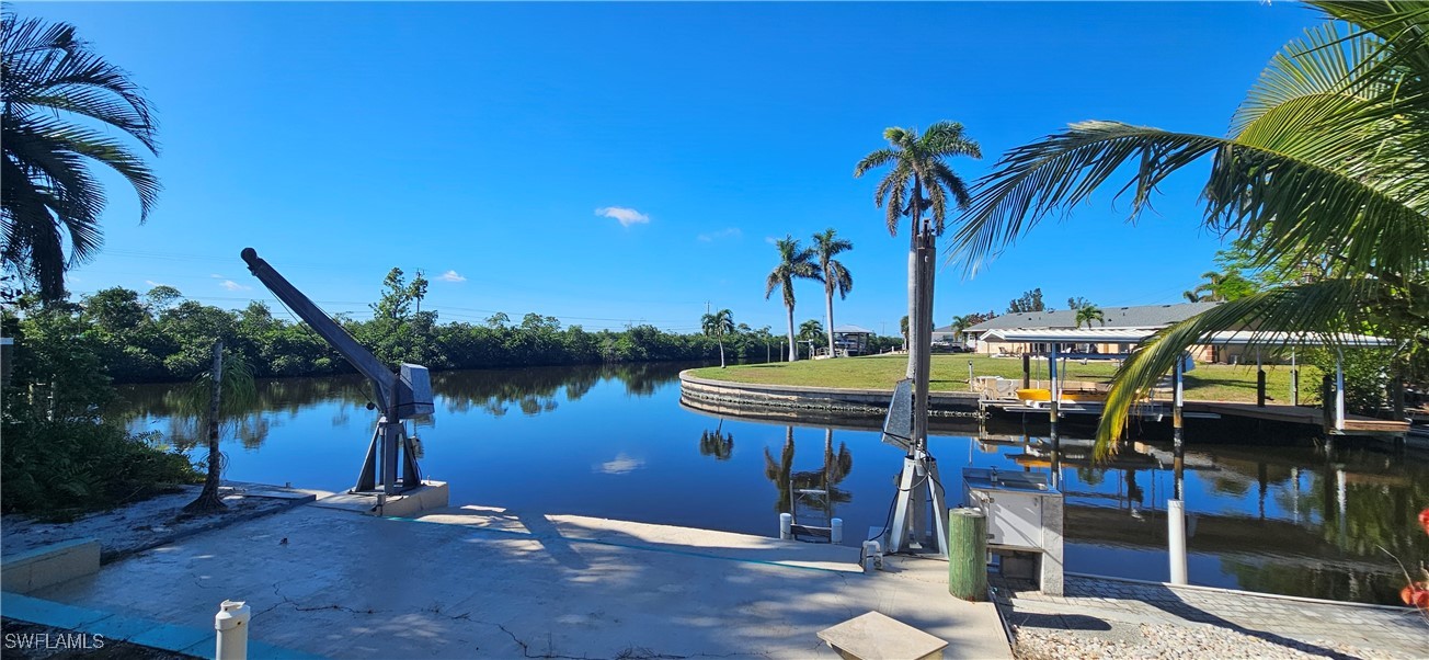 12101 Moon Shell Drive Matlacha Isles, FL 33991 - Photo 41 of 42 a view of a lake with a table and chairs
