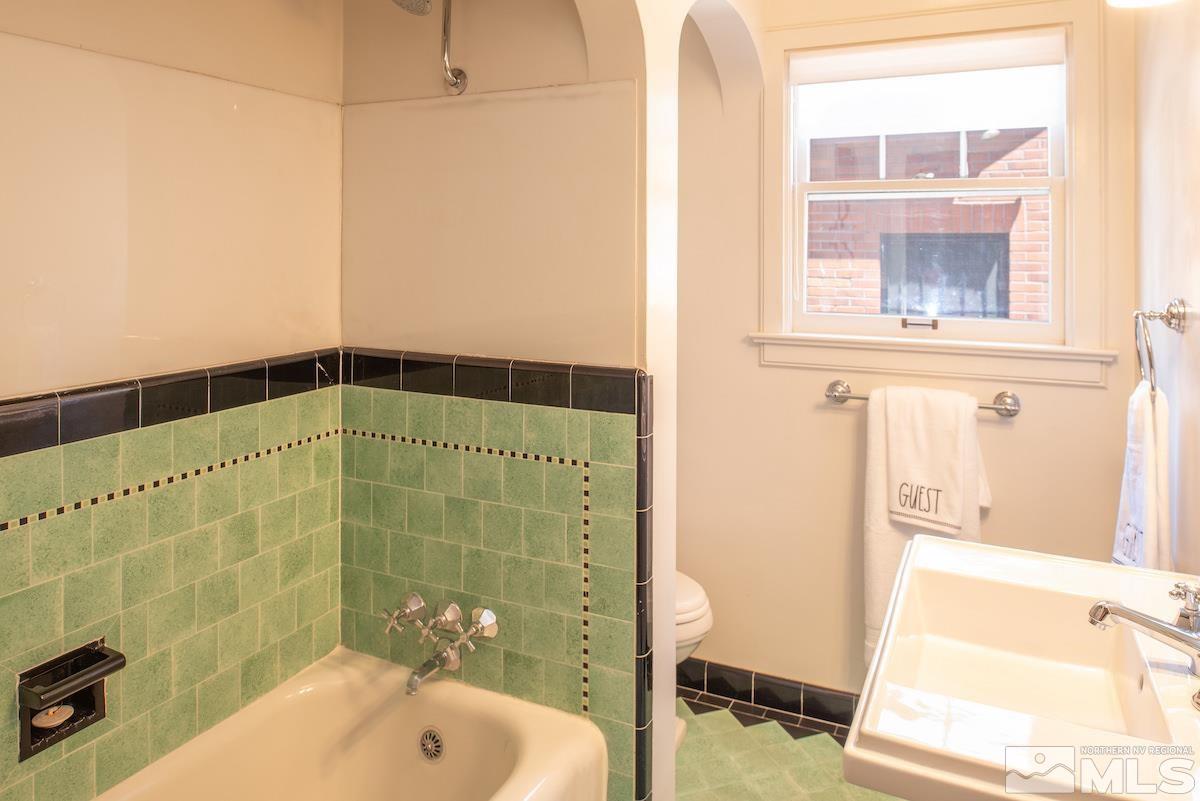 895 Lander Street Reno, NV 89509 - Photo 12 of 38 a bathroom with a shower and a sink