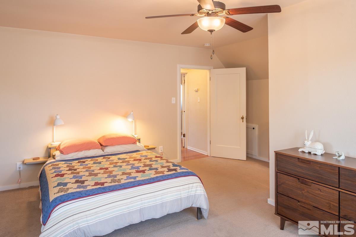 895 Lander Street Reno, NV 89509 - Photo 14 of 38 a bedroom with a bed and a dresser