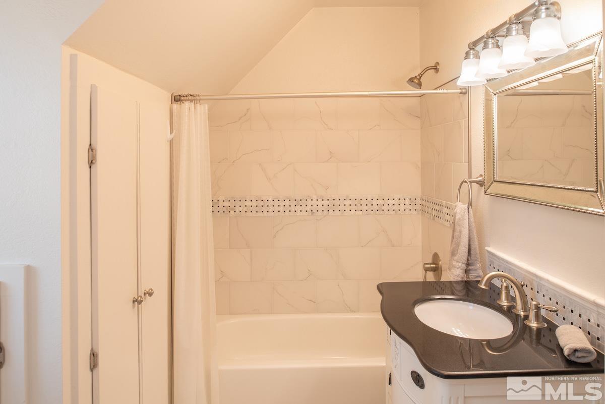 895 Lander Street Reno, NV 89509 - Photo 15 of 38 a bathroom with a sink a toilet and a bathtub