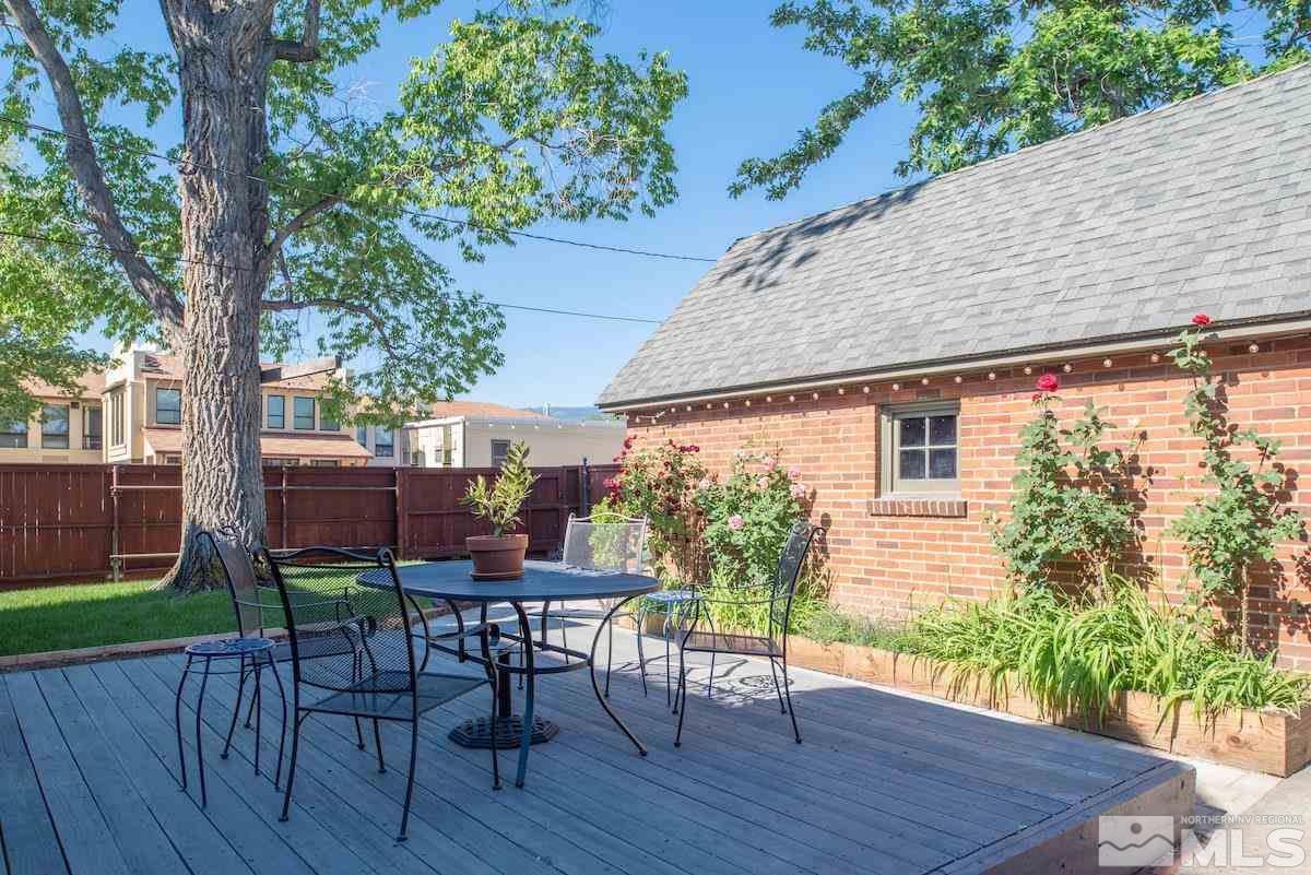 895 Lander Street Reno, NV 89509 - Photo 22 of 38 a backyard of a house with table and chairs