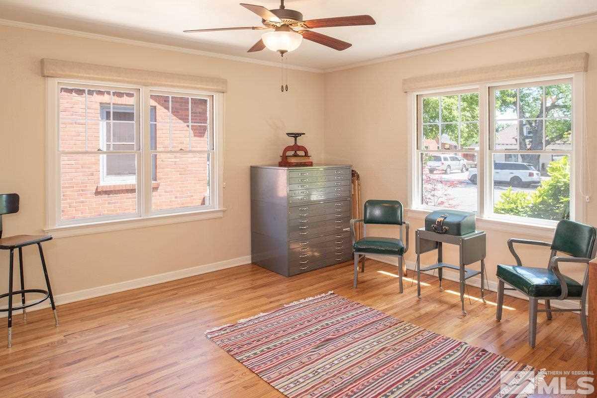 895 Lander Street Reno, NV 89509 - Photo 10 of 38 a workspace with wooden floor and windows