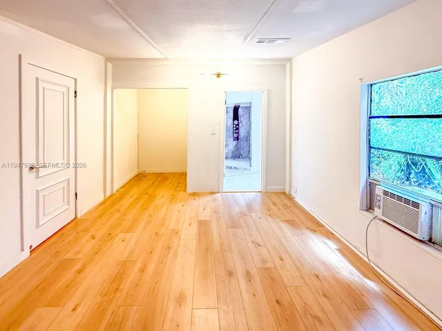 a view of an empty room and window