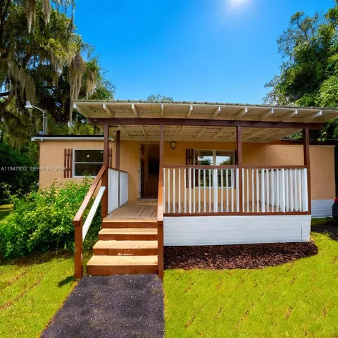 a view of a house with a small yard