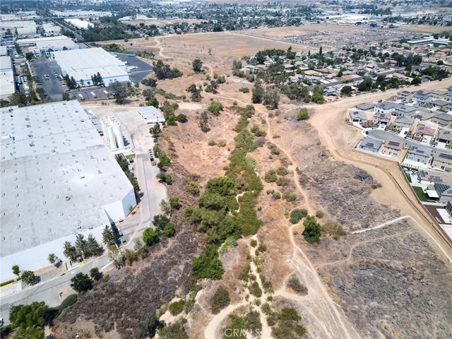 an aerial view of residential house and sandy dunes