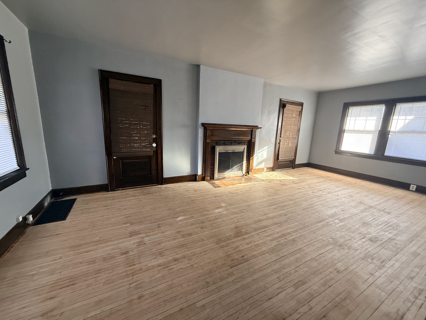 617 West Lincoln Way Morrison, IL 61270 - Photo 9 of 21 wooden floor fireplace and windows in an empty room