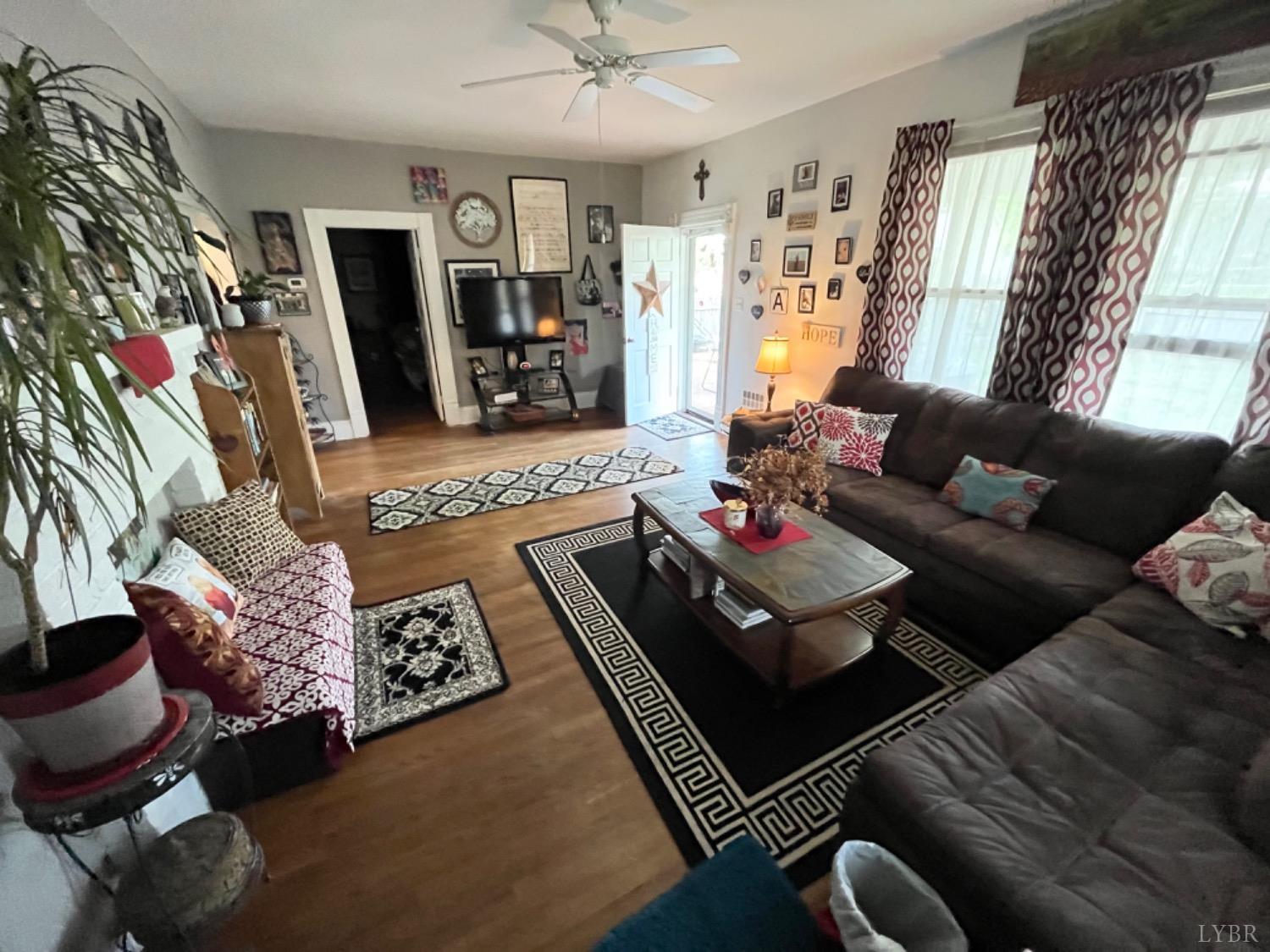 165 Cedar Gate Road Monroe, VA 24574 - Photo 15 of 37 a living room with furniture and a flat screen tv